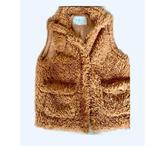 Veste sans manches d’occasion bon état pour femme.