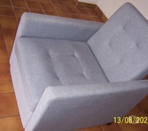 un fauteuils convertible état neuf