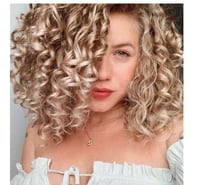 KATE BLUE EYES AND CURLY HAIR.