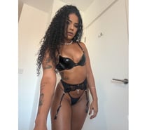 Slim Brazilian brunette with curly hair