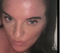 Blue eyed busty MILF